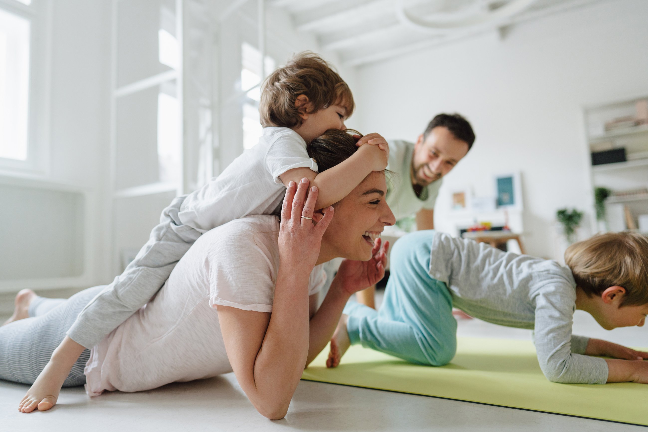 Young family exercising at home